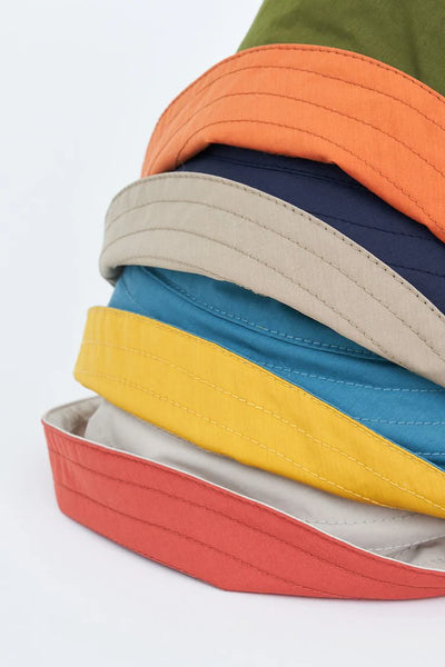 Tanta Breca Waterproof Rain Hat, Sphagnum and Apricot Orange - Flax In Bloom