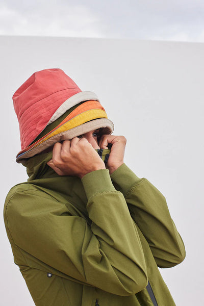 Tanta Breca Waterproof Rain Hat, Sphagnum and Apricot Orange - Flax In Bloom